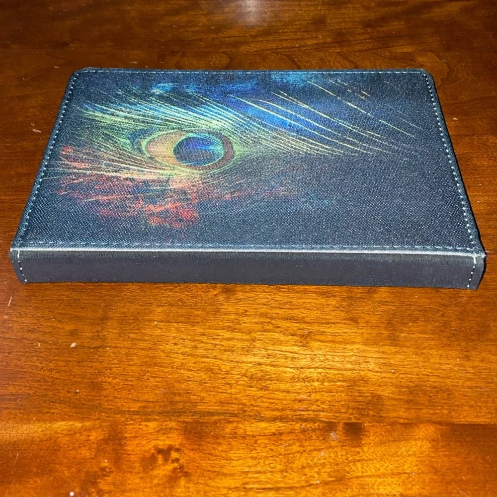 Caseable Tablet case cover 7” with peacock feather motif. Excellent pre used